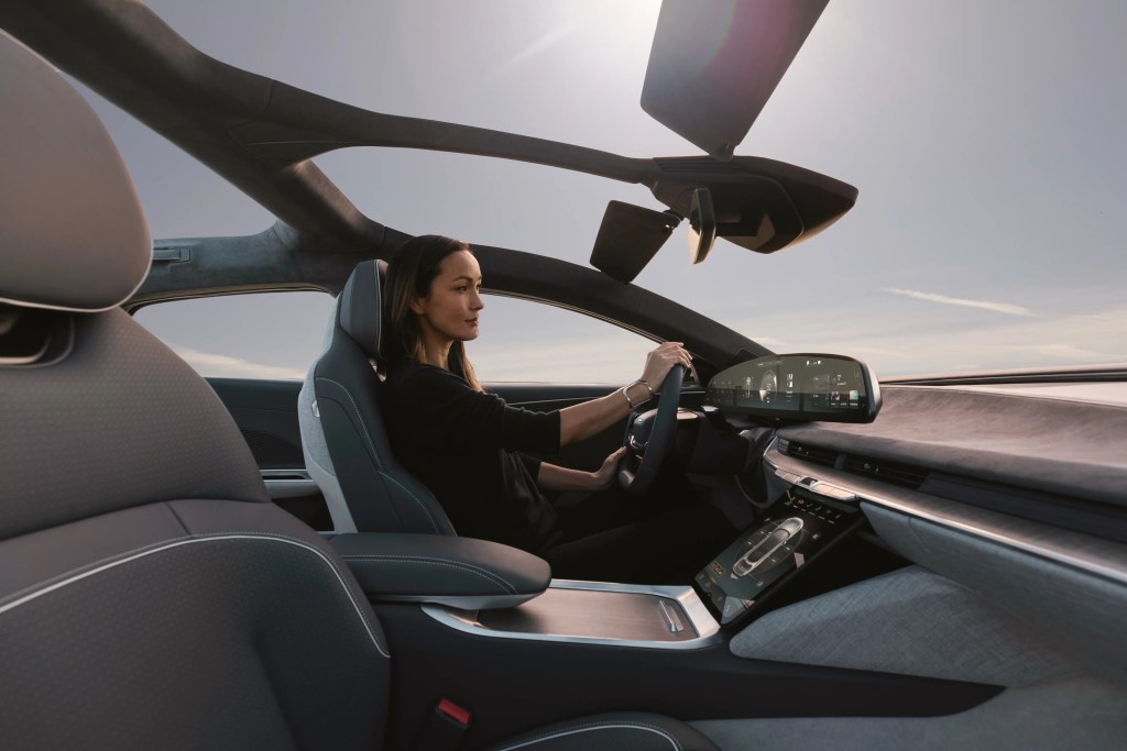 Woman driving Lucid Air