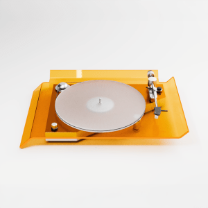 The DEKO turntable from The Kickback, shown from the top angle, features an orange plexi base