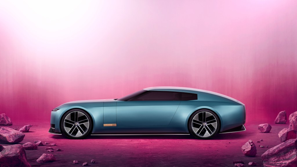 blue jaguar concept car on pink background