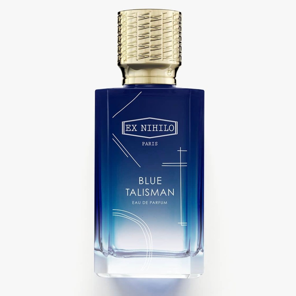 A bottle of Ex Nihilo's Blue Talisman eau de parfum. Blue glass with white lines on it and a gold cap