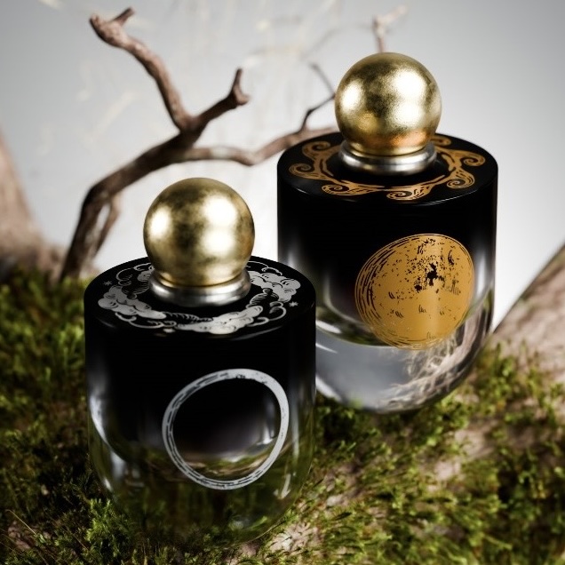 two perfume bottles on a mossy branch