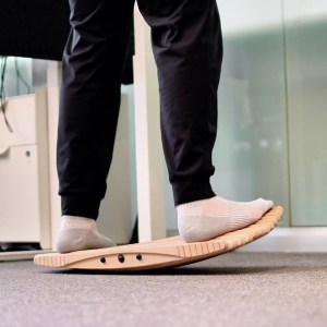 A person is standing on a Movemate board
