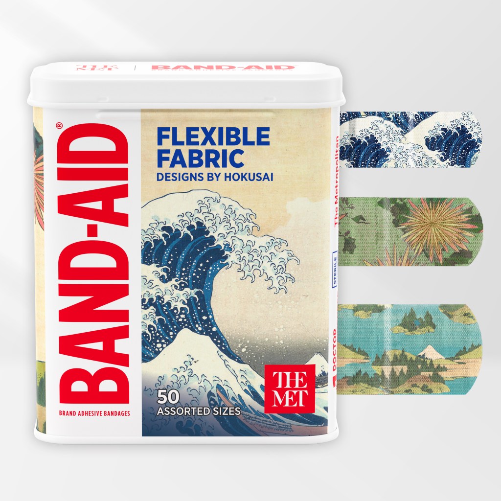 A box of Band-Aids featuring flexible fabric bandages with design by Hokusai on them