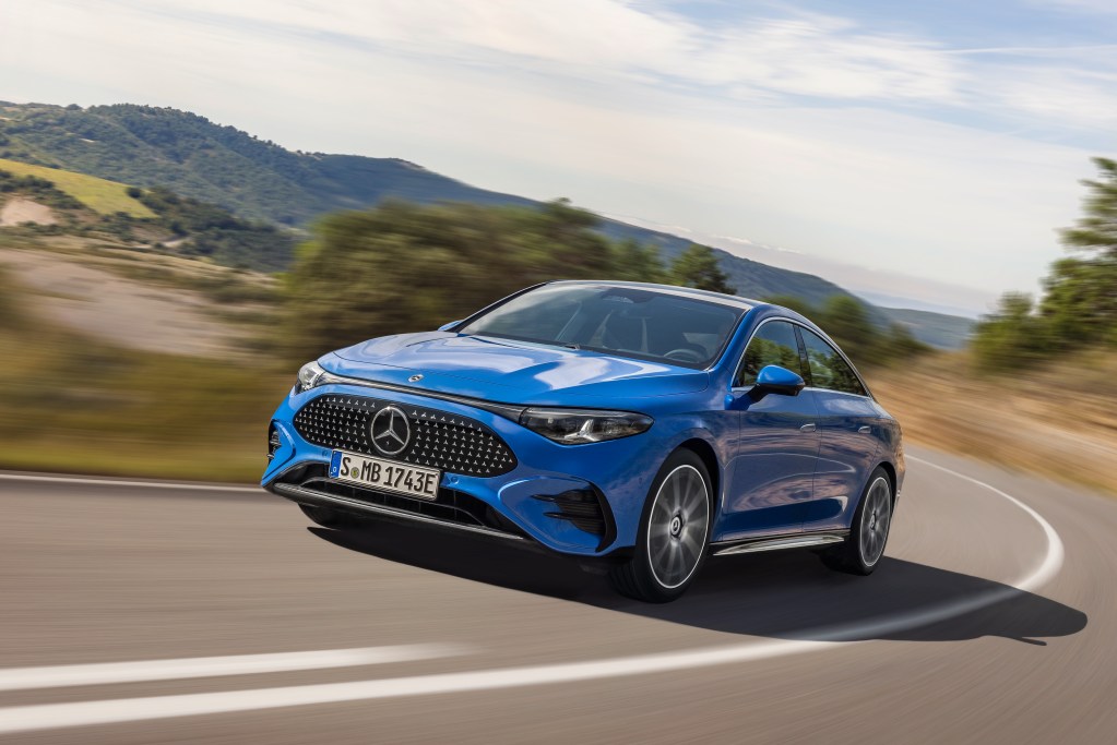 The all-new Mercedes-Benz CLA in blue shown on a road