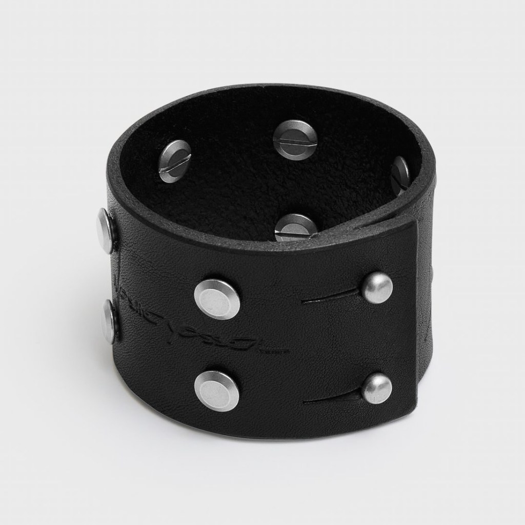 A shot of a black leather bracelet with metal studs by Moshe Yossel
