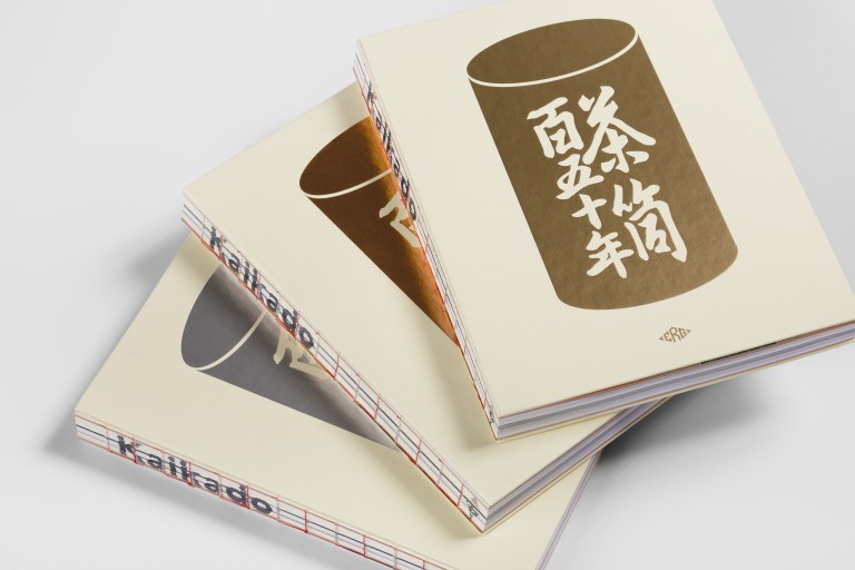 Three books, one with each cover, in a stack