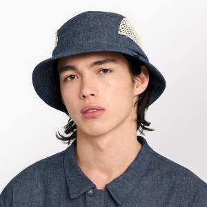 Ciele Athletics' denim and mesh running hat is worn by a male model