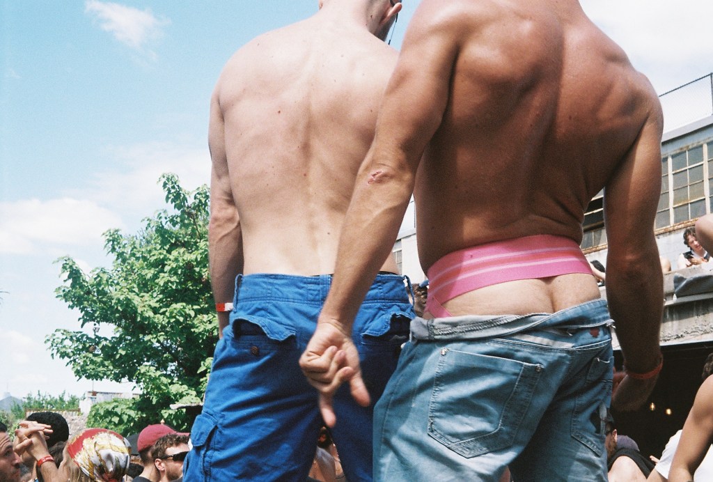 Two men without shirts at a dance festival