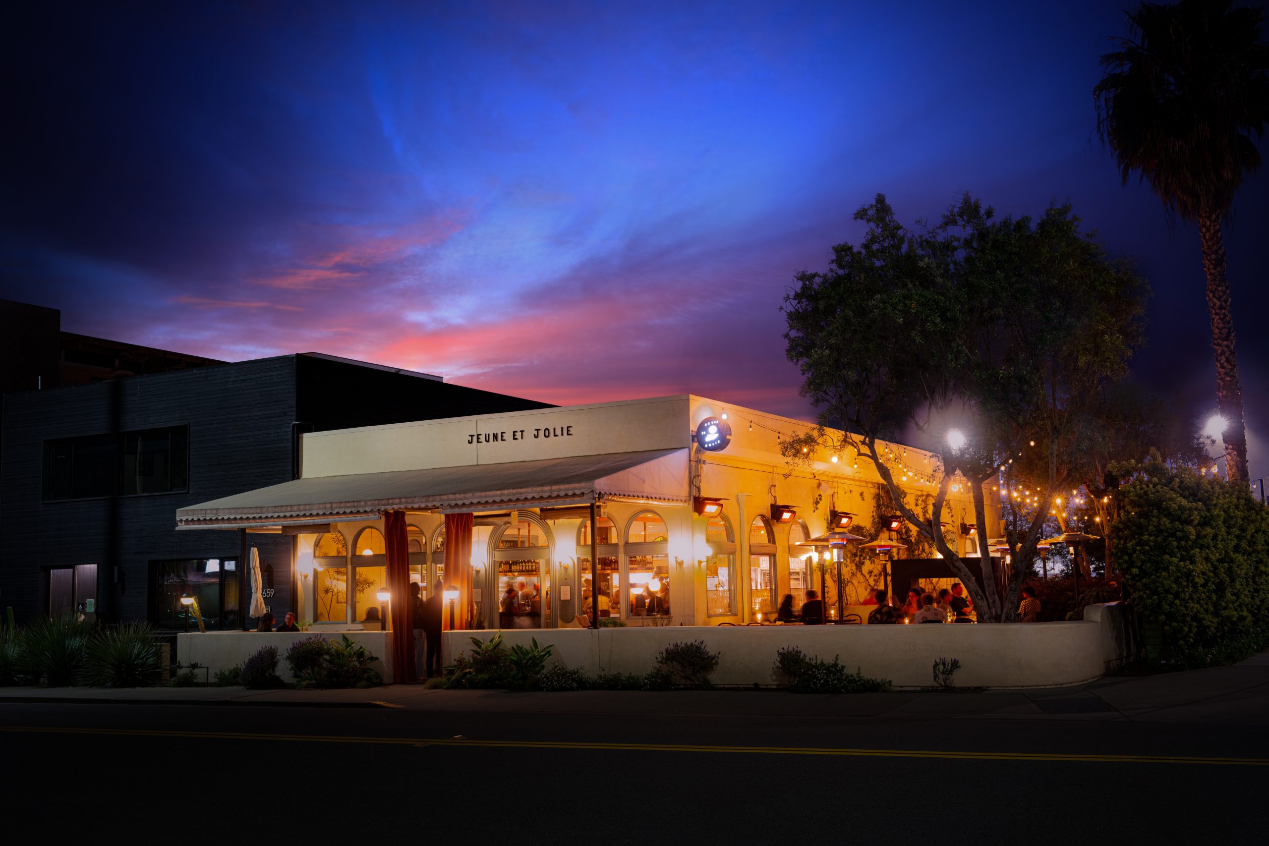 Exterior view of Jeune et Jolie shot at night