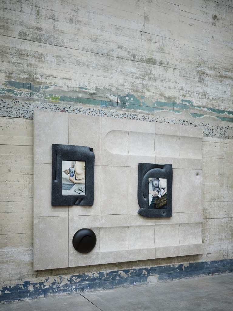 Three works by Klara Hosnedlova, hung on a concrete panel in a concrete gallery room.