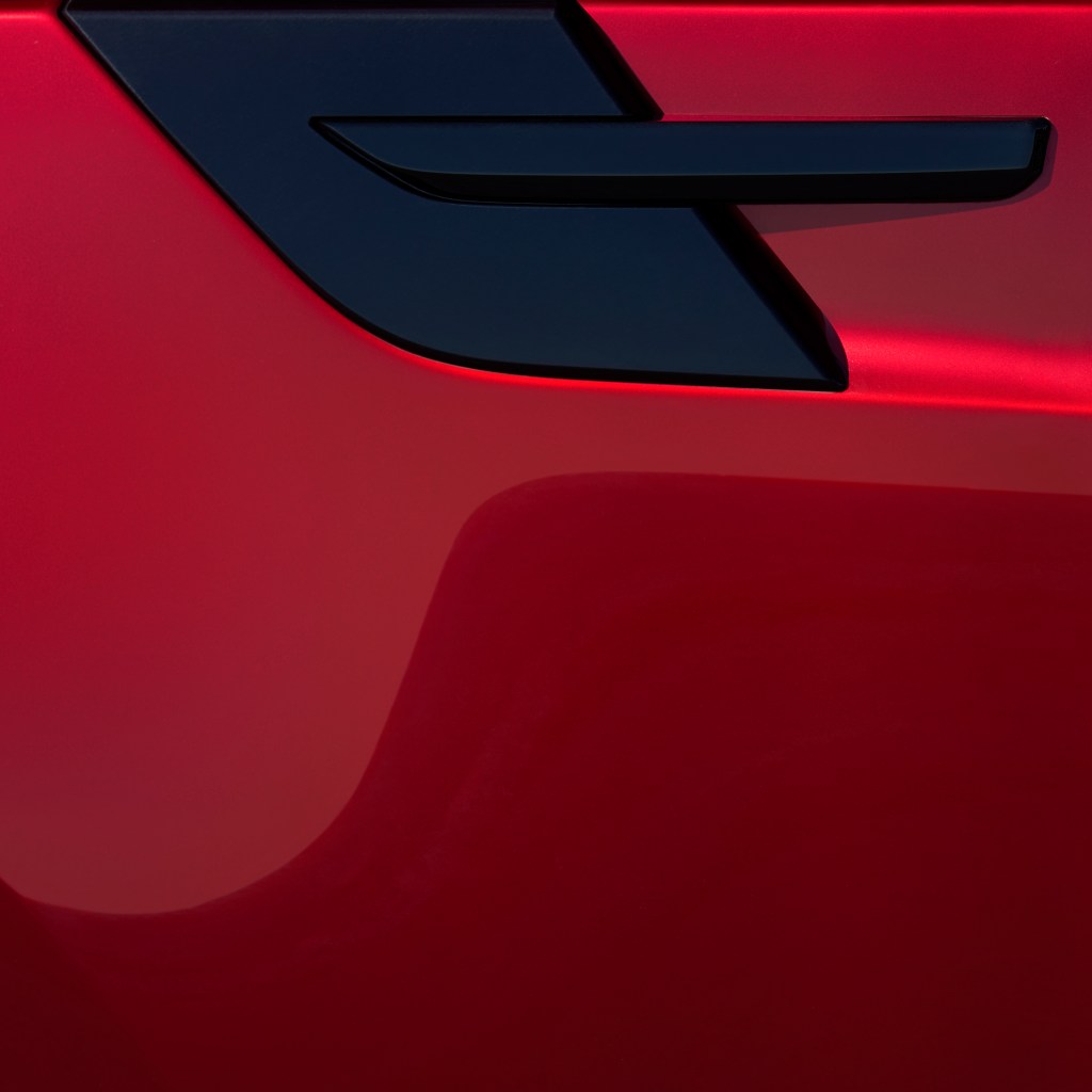 A detail of a red Range Rover Sport.