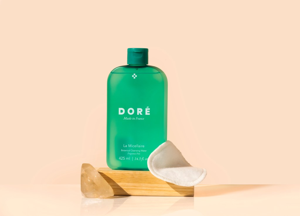Dore Micellaire cleanser on a peach background.