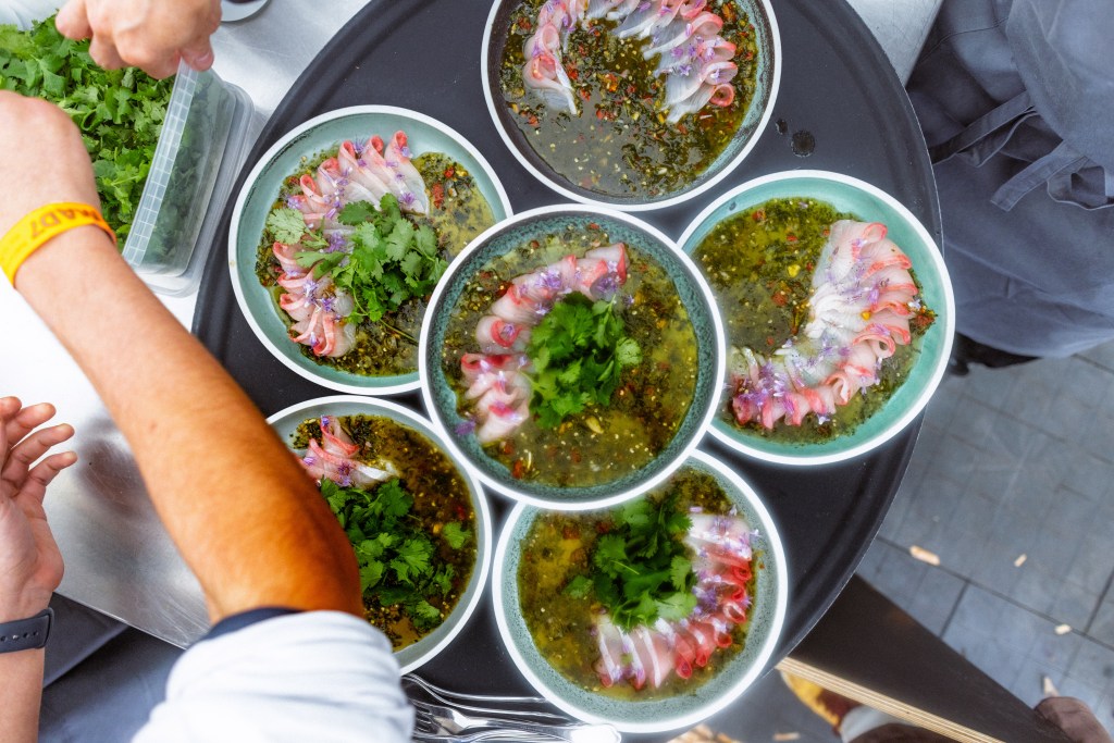 Noma chefs in Copenhagen preparing Anajak Thai dishes at the MAD Conference.