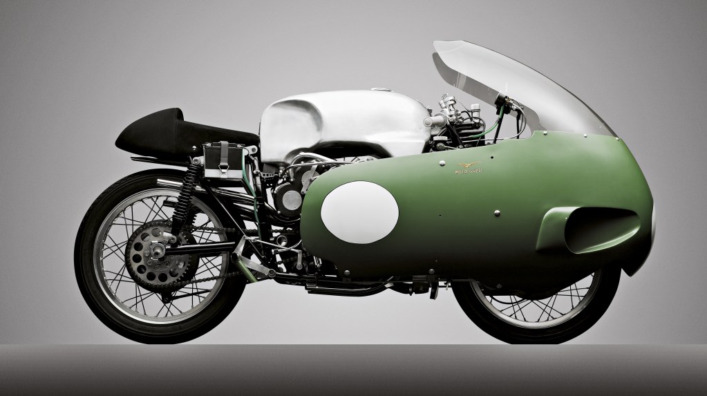 A green round motorcyle, the 1955 Guzzi V8 Otto.