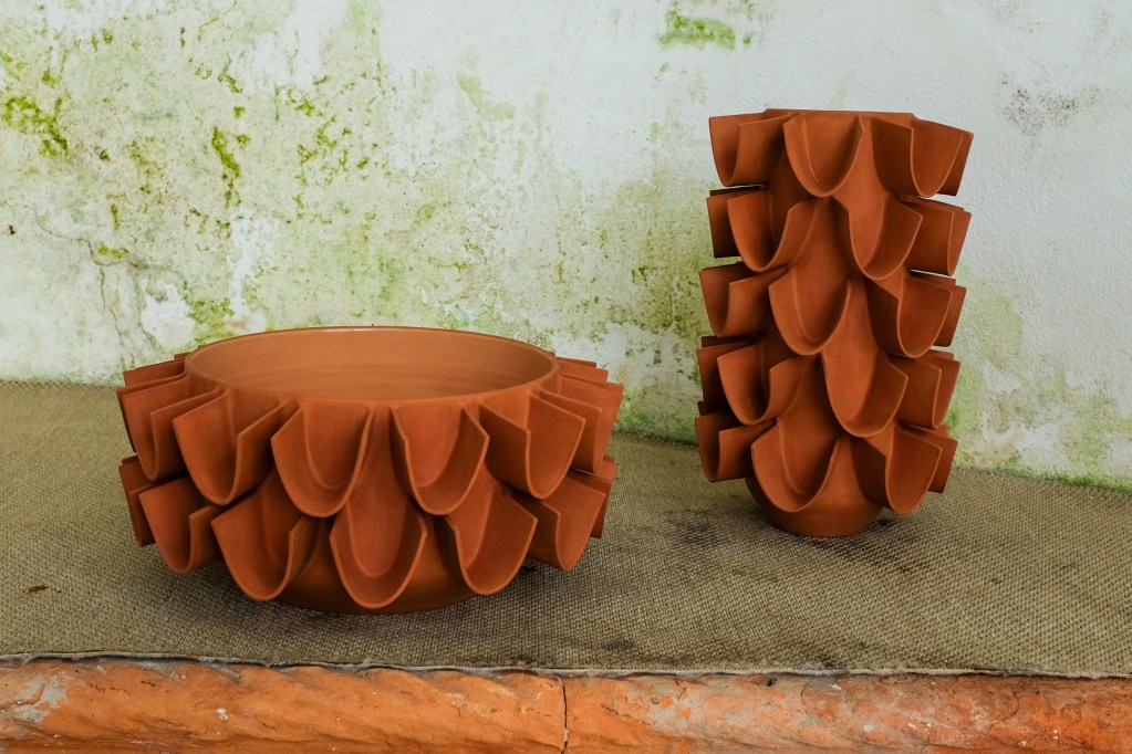 Two textured terracotta vases at 2025's Lake Como Design Festival.