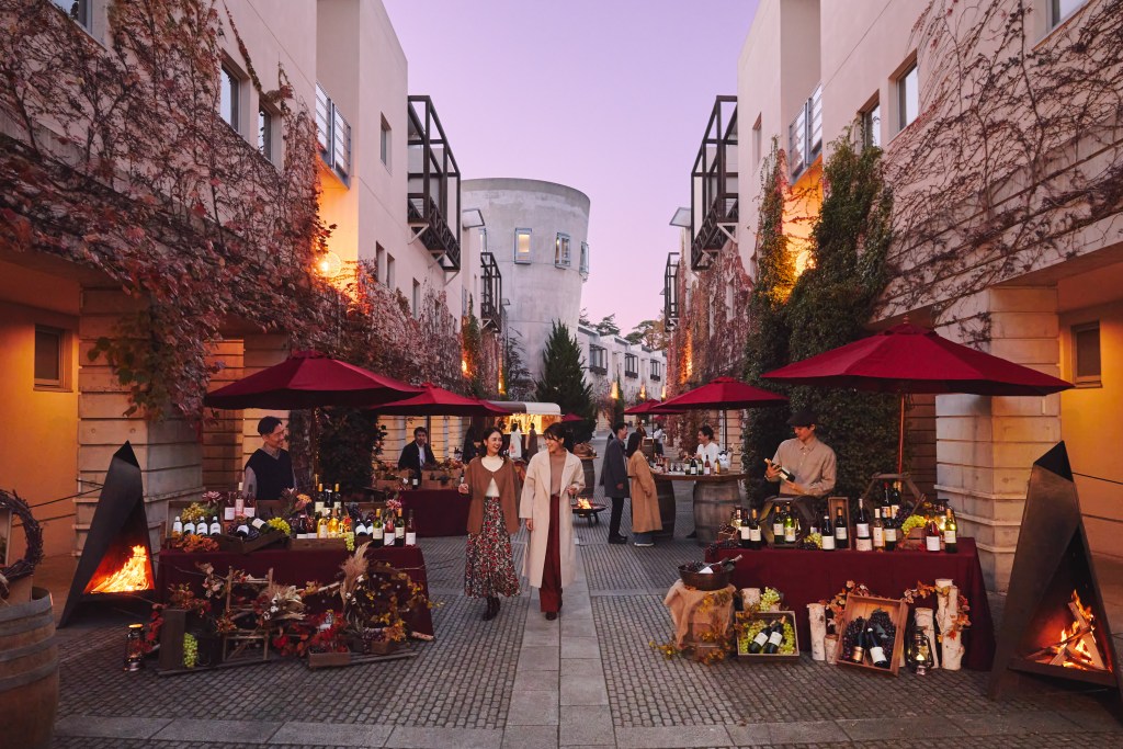Piment Street in Autumn with wine vendors and people shopping. 