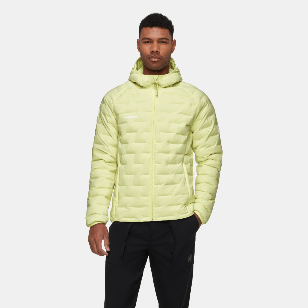 A man wearing a lime green Mammut jacket.