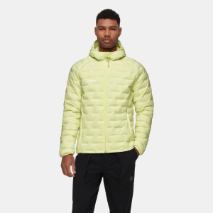 A man wearing a lime green Mammut jacket.