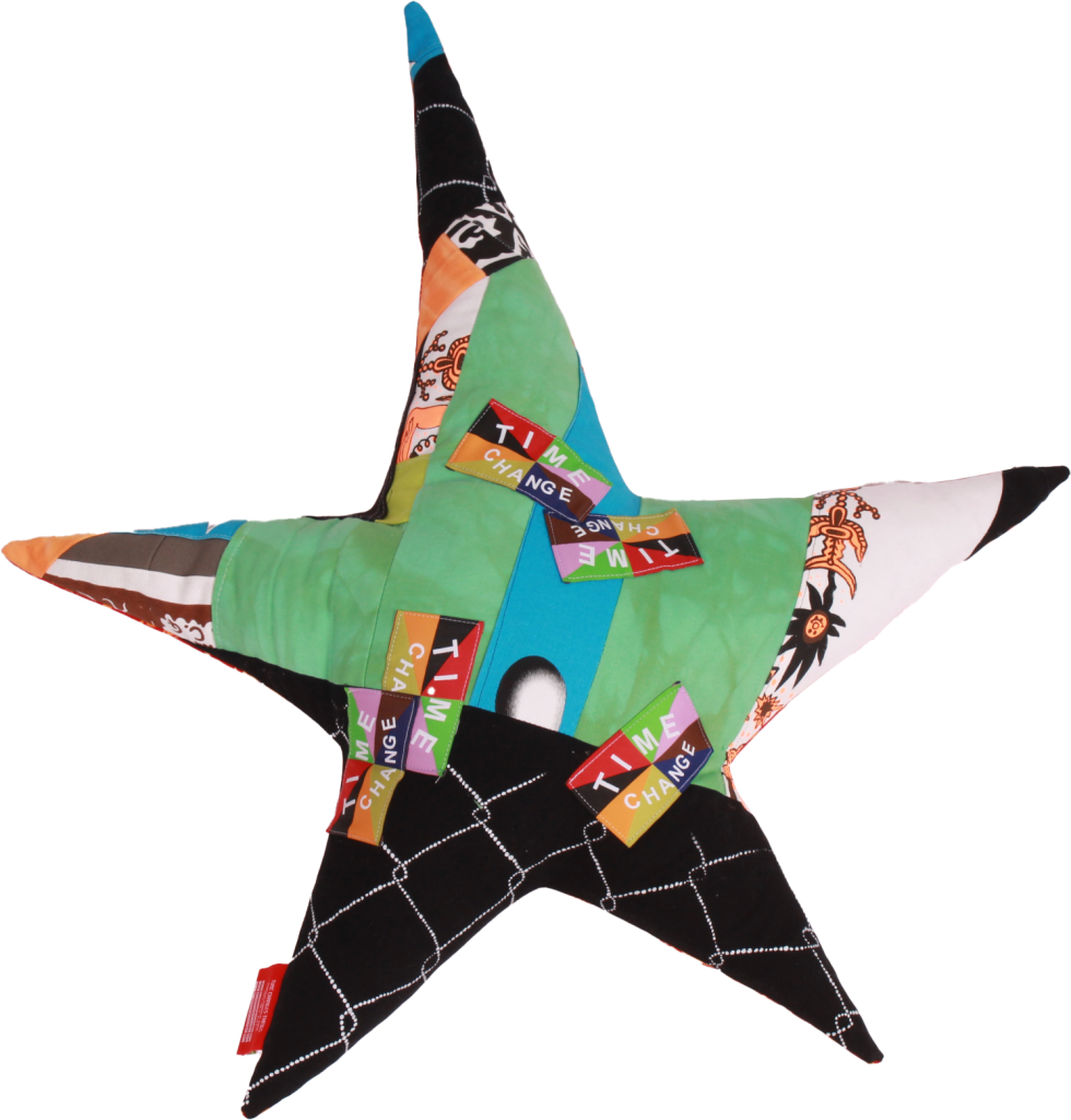 A star pillow sewn out of fabric scraps.