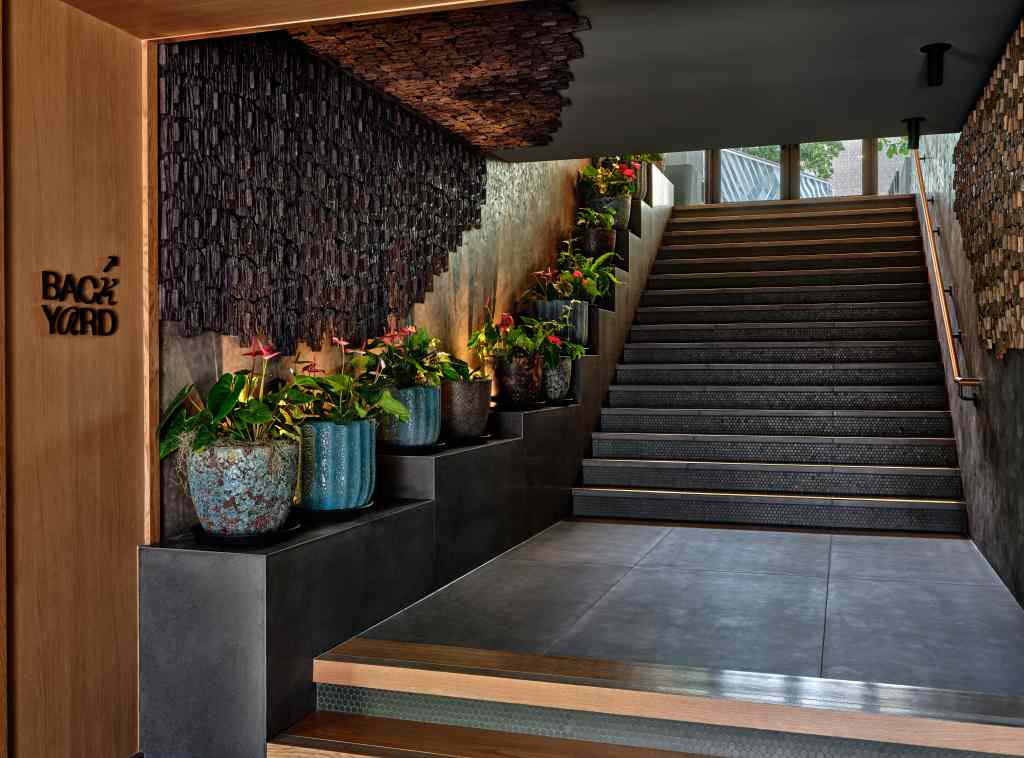 The stairs leading to the backyard at Romer House Waikiki.