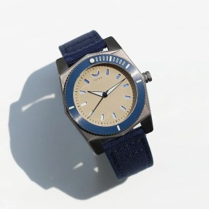 Papar's Cenote watch in titanium and blue sits on a plain background