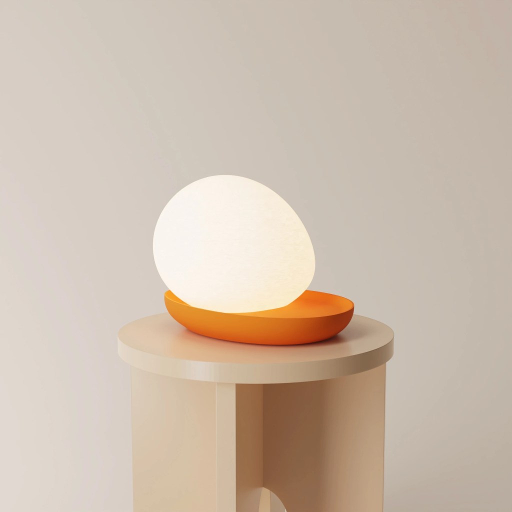 Gantri's Baltri Table Light by Kickie Chudikova features a colored platform base with an egg-shaped light