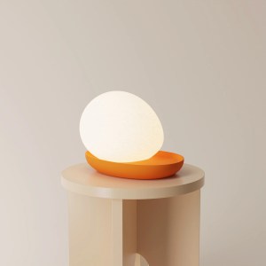 Gantri's Baltri Table Light by Kickie Chudikova features a colored platform base with an egg-shaped light