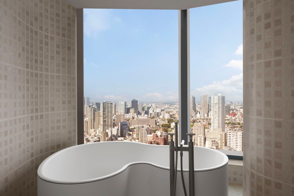 A bathtub with city skyline views at JW Marriott Tokyo.