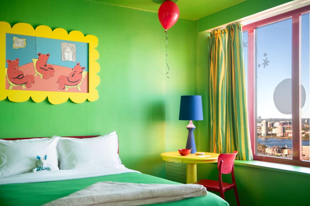 The Goodnight Moon suite at the Sheraton Boston shows the brightly colored room with details from the book, inlcuding a red balloon