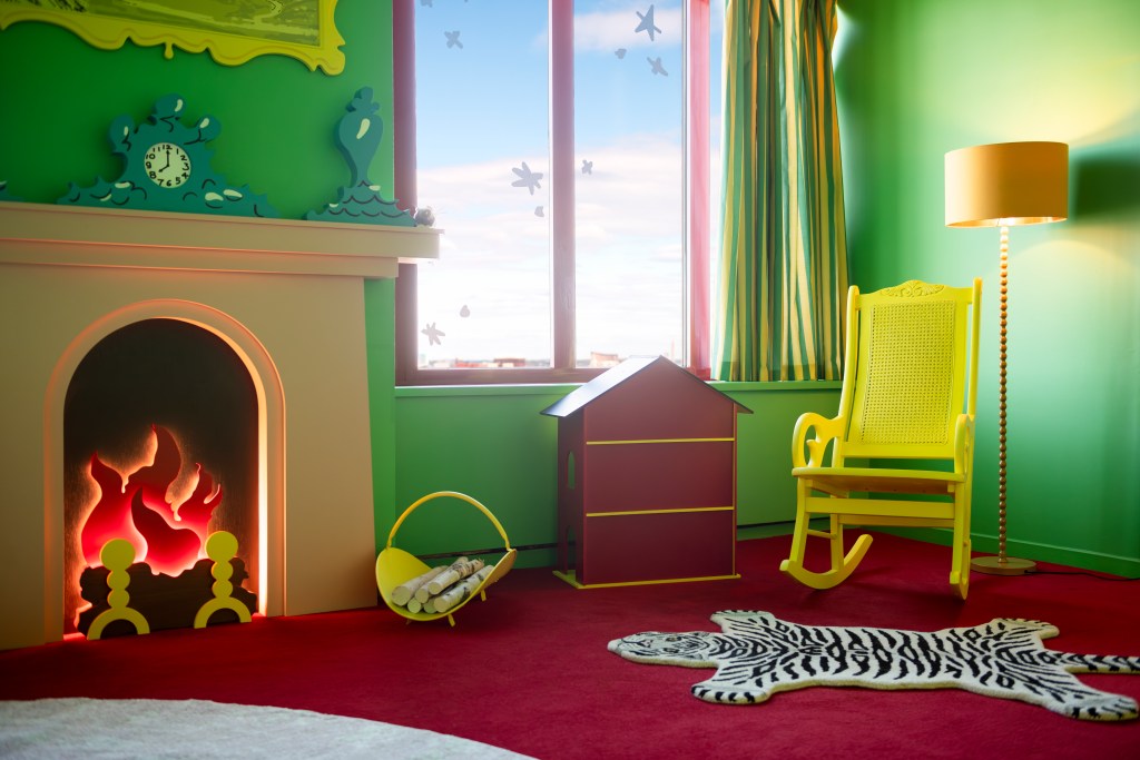 The Goodnight Moon suite at the Sheraton Boston shows the brightly colored room with details from the book, including a dollhouse, fireplace and yellow rocker