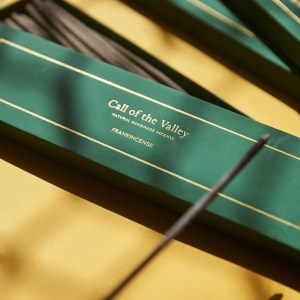A green box with the words Call of the Valley, natural handmade incense, and Frankincense; the box is partially open to display the incense