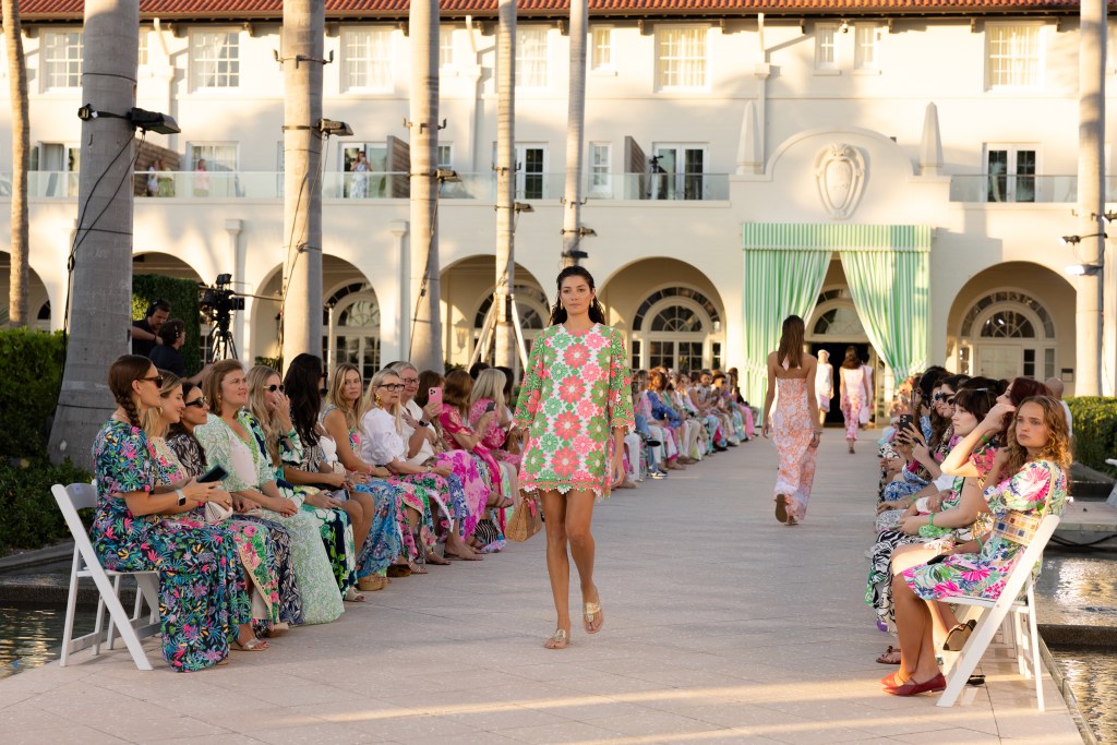 A model walking the Lilly Pulitzer Spring 2026 show wearing a vintage-inspired shift dress.