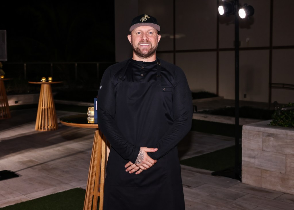Chef Jeremy Ford stands in front of tables