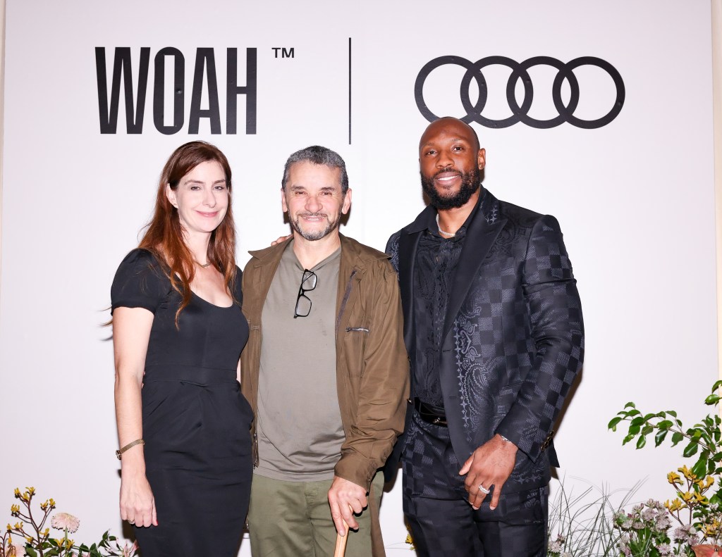 Tamara Warren, Lee Quiñones, Starling Marte in front of a sign for the event