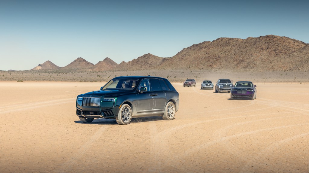 A group of cars in a lakebed outside of Las Vegas.