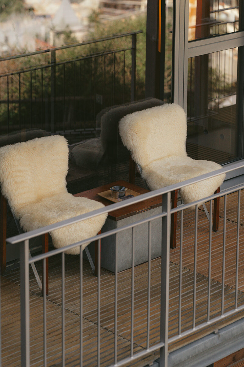 Sheepskin-covered chairs on the deck at The Omnia.