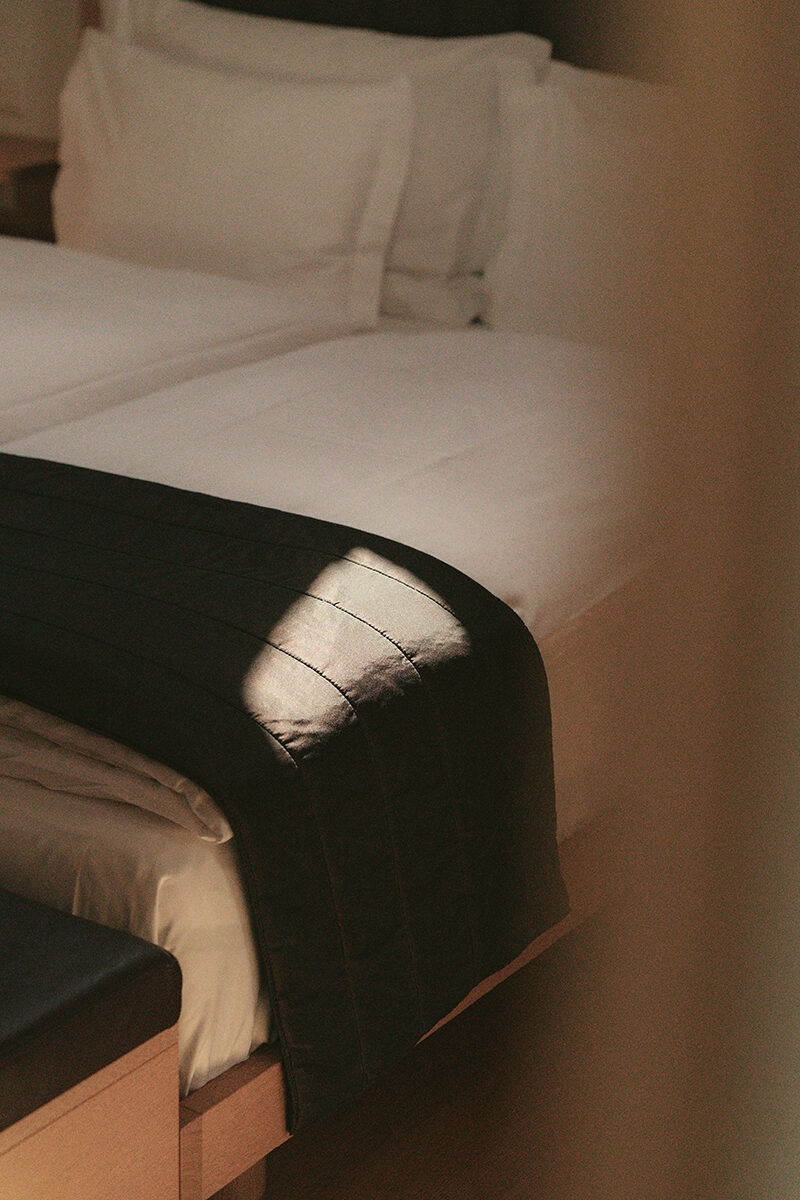 A detail of a guest room bed at The Omnia.