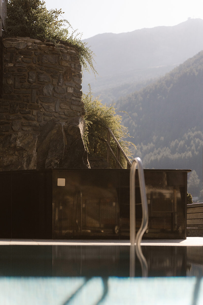 The pool at The Omnia with the mountains in the background.