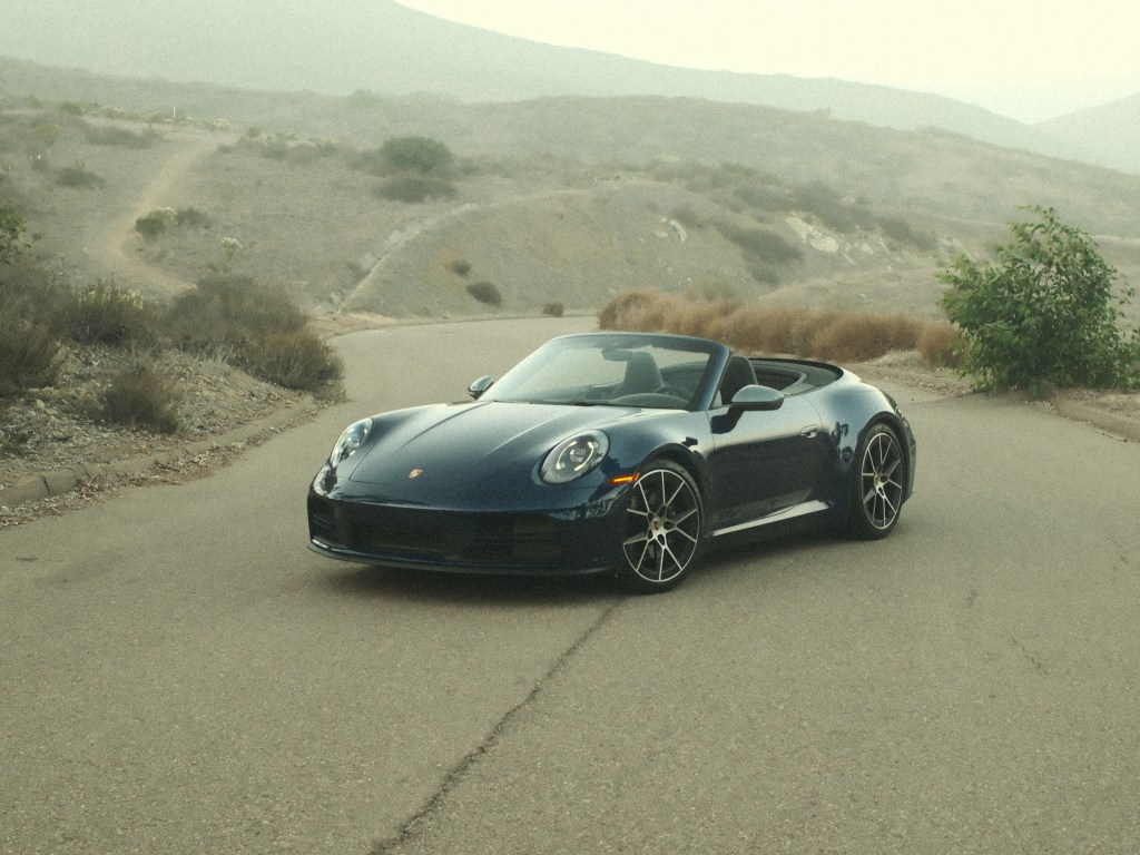 The 2025 Porsche Carrera T Cabriolet parked on a quiet road in Southern California.