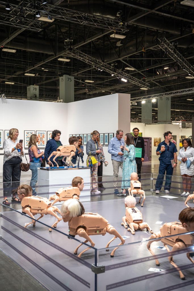 Beeple's "Regular Animals" featuring flesh-colored robot dogs with realistic masks of famous billionaires.