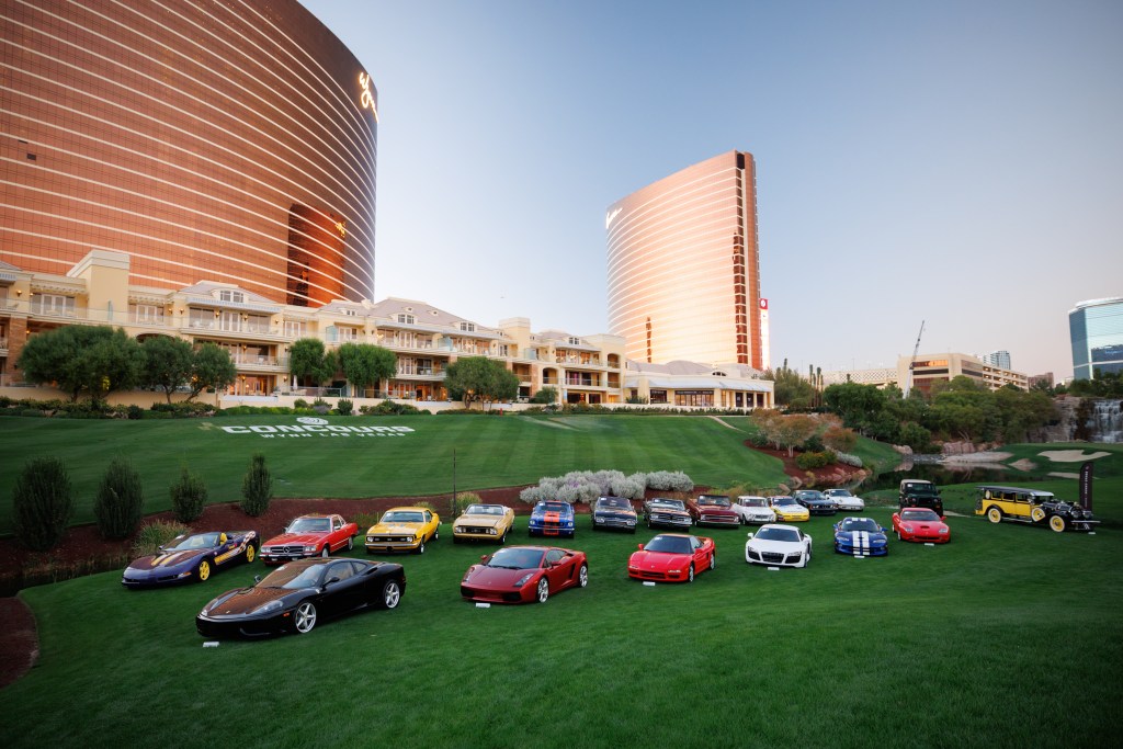 A lineup of cars parked on the grass at the Las Vegas Concours d’Elegance.