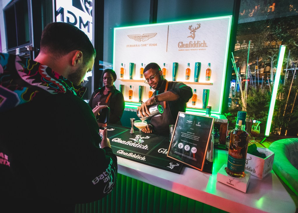 A bartender serving a drink at the Glenfiddich F1 space in Las Vegas.