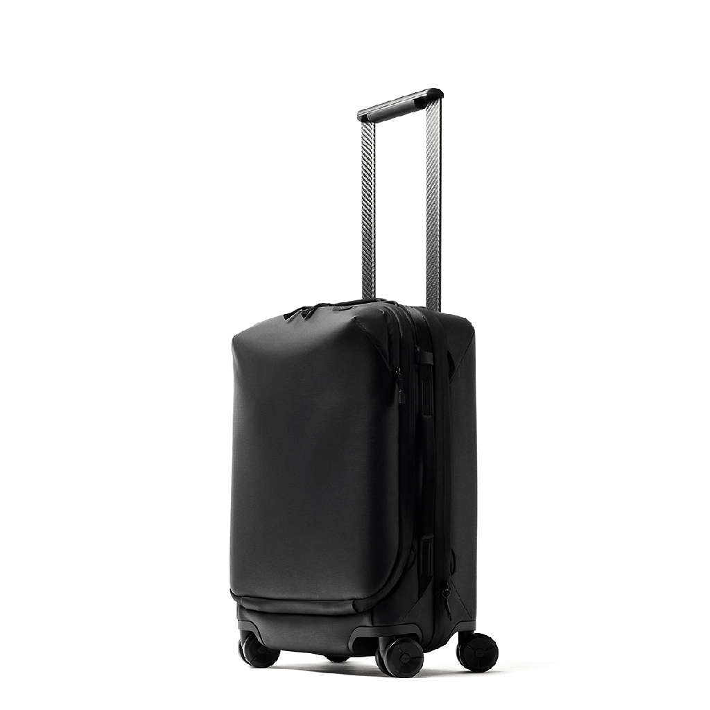 A Peak Design Roller Pro bag with its carbon trolley handle moving up and down.