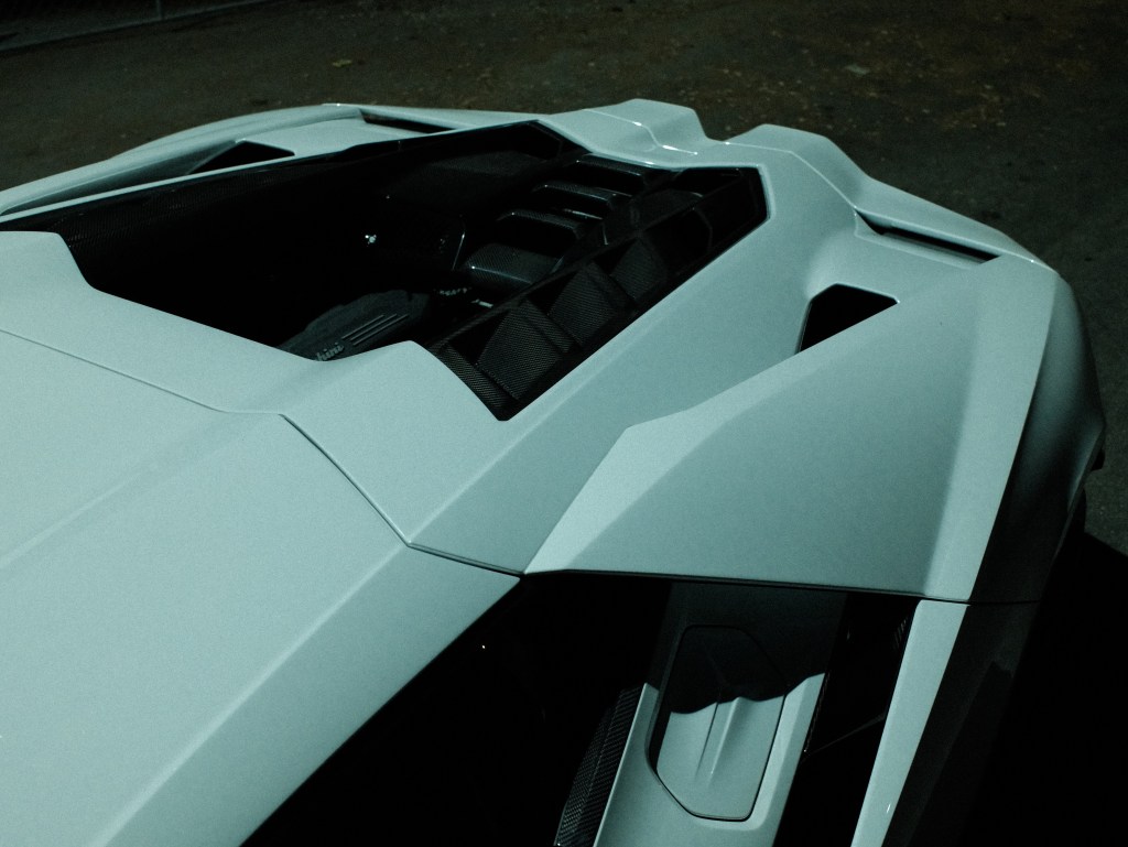 The aerodynamic exterior of a white Lamborghini Revuelto.