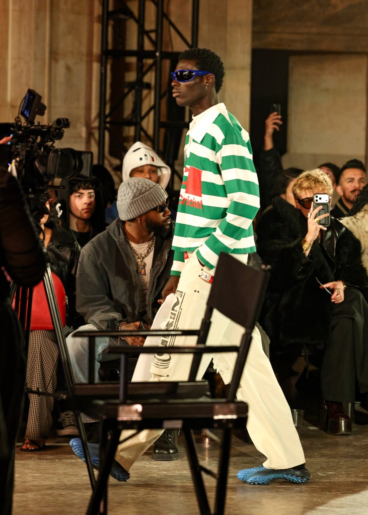 A male model walking in the F26 AWGE runway show in Manhattan's Financial District.
