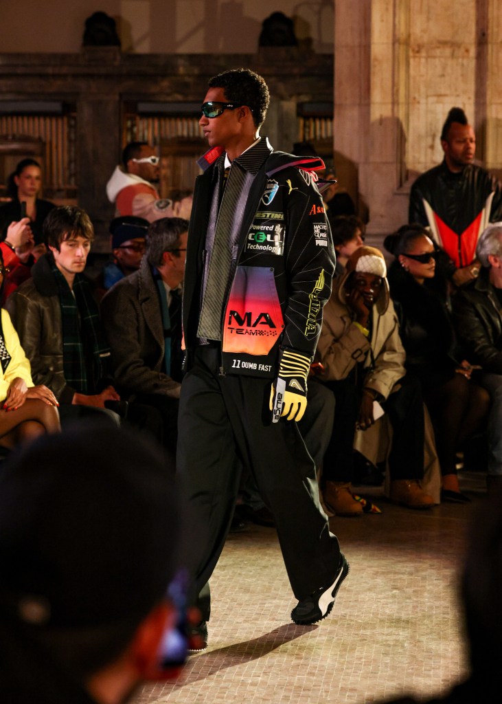 Model Joshua Seth walking in the F26 AWGE runway show in Manhattan's Financial District.