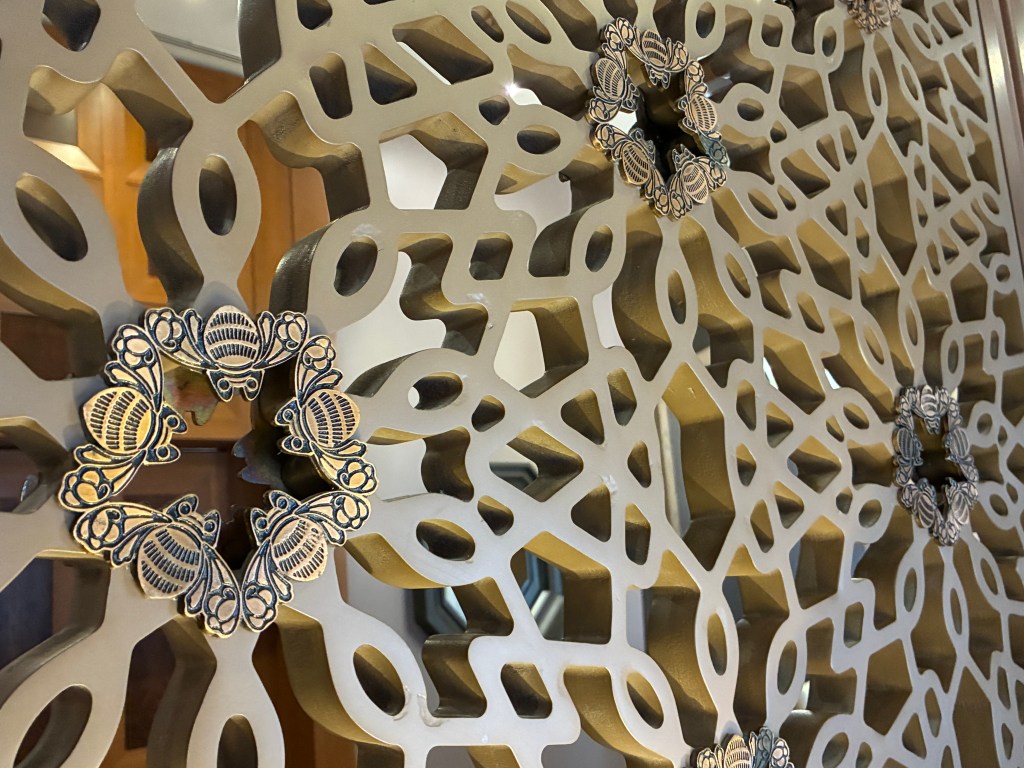 A detail of a La Casona room divider featuring a bee design.