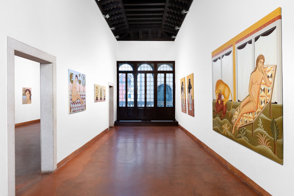 A view of several Ismaele Nones paintings hanging in a wide hallway at Tommaso Calabro's gallery.
