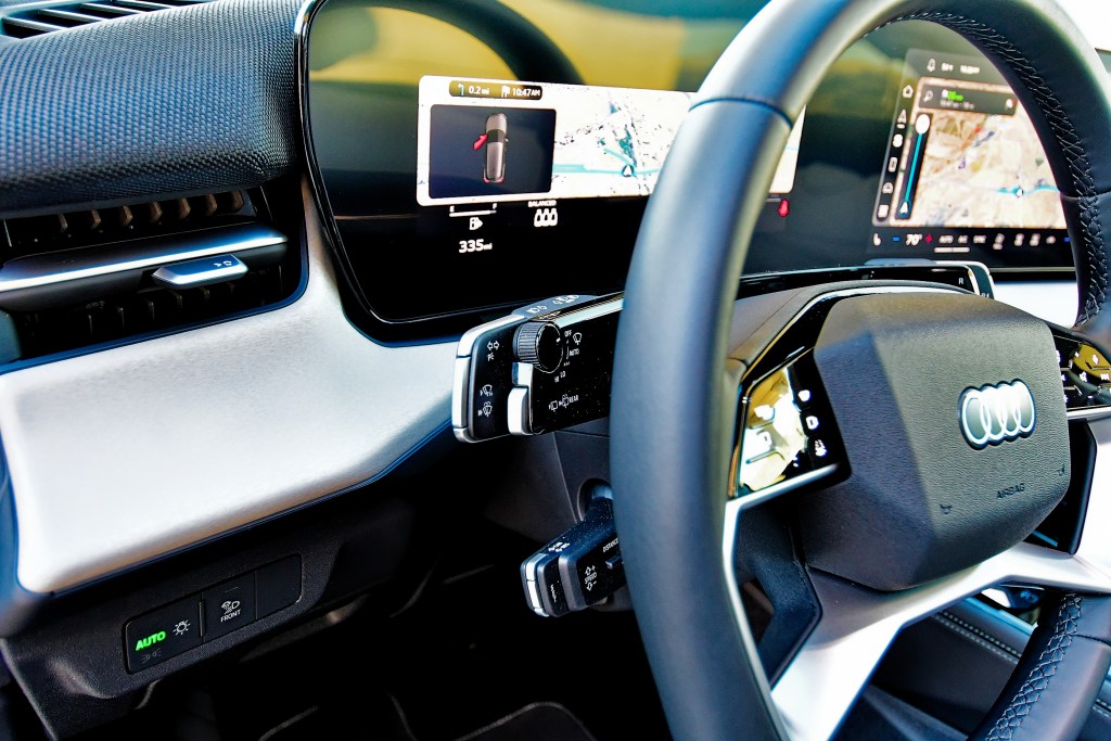 Closeup of the steering wheel of the new Audi Q3 and the controls on the left side of it