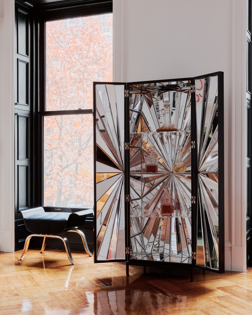 Errazuiz's mirrored cabinet alongside a stool by Brett Robinson